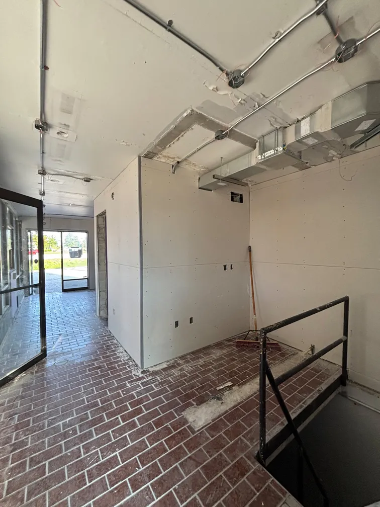 Interior drywall and HVAC installation during car wash restoration in Winter Park, FL