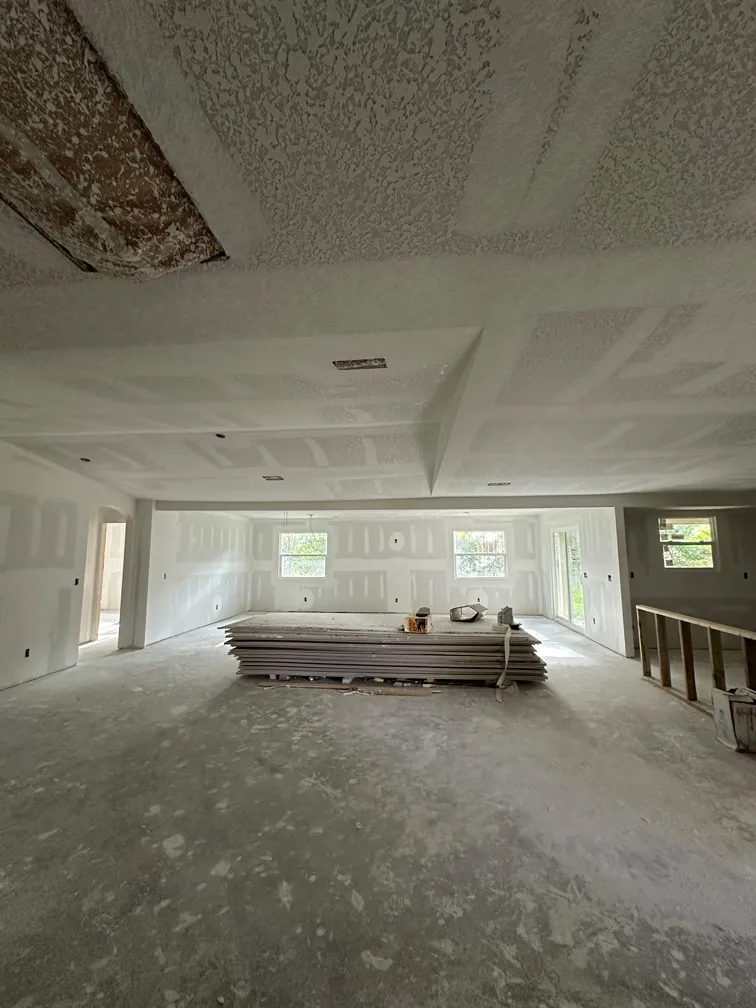 Interior view of textured drywall installation during house renovation in North Tampa