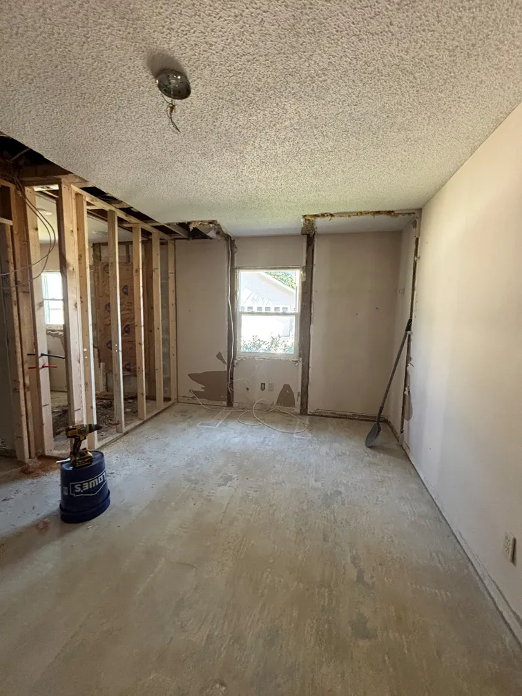 Framing and popcorn ceiling in partially renovated room in North Tampa