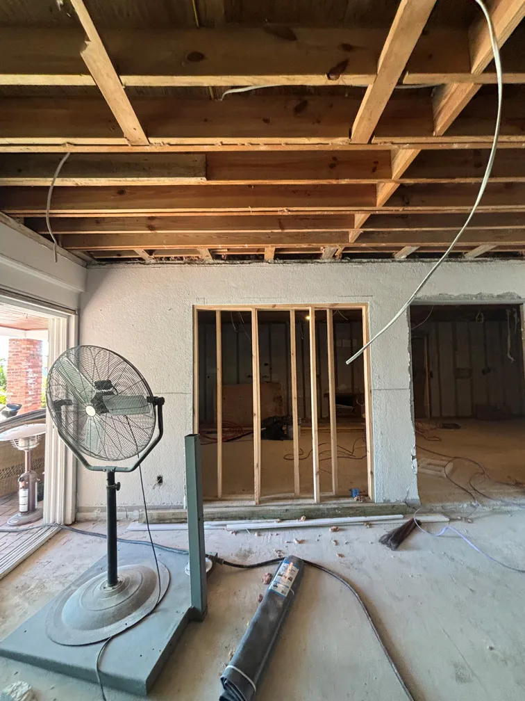 Interior ceiling with exposed wooden framing during home renovation in Tampa