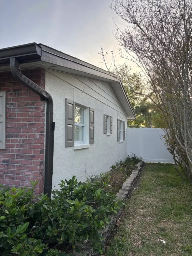 Side view of house before exterior painting project in Tampa, Florida