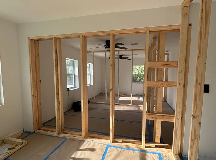 Drywall and wood framing during home renovation in Florida Wood framing and drywall installation by home remodeling company top of work in florida